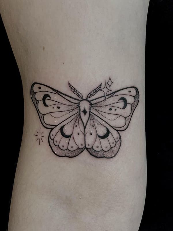 minimalist moth tattoo