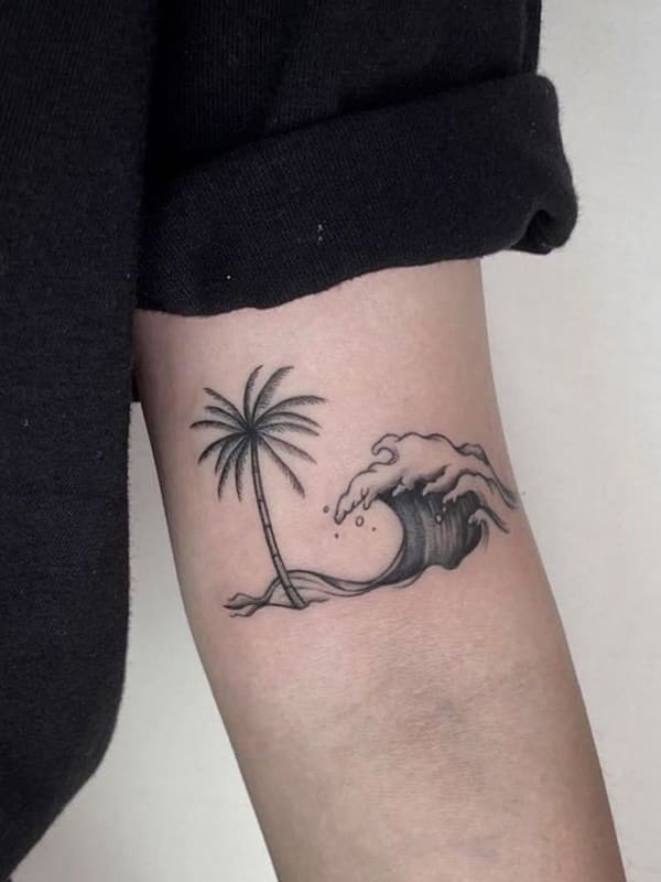 palm tree and wave tattoo