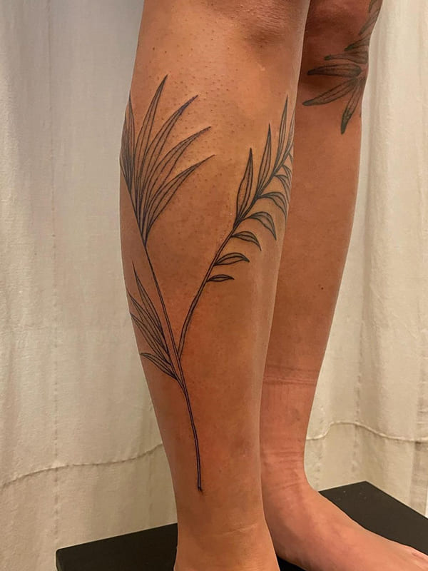 palm tree leaves tattoo
