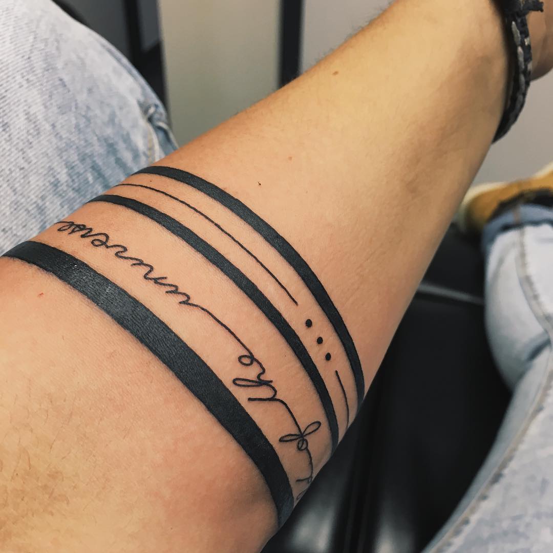 Negative space mountainous landscape armband tattoo | Arm band tattoo,  Feather tattoos, Cool arm tattoos