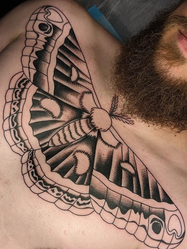 moth chest tattoo