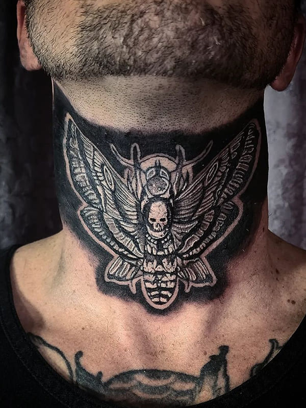 moth neck tattoos