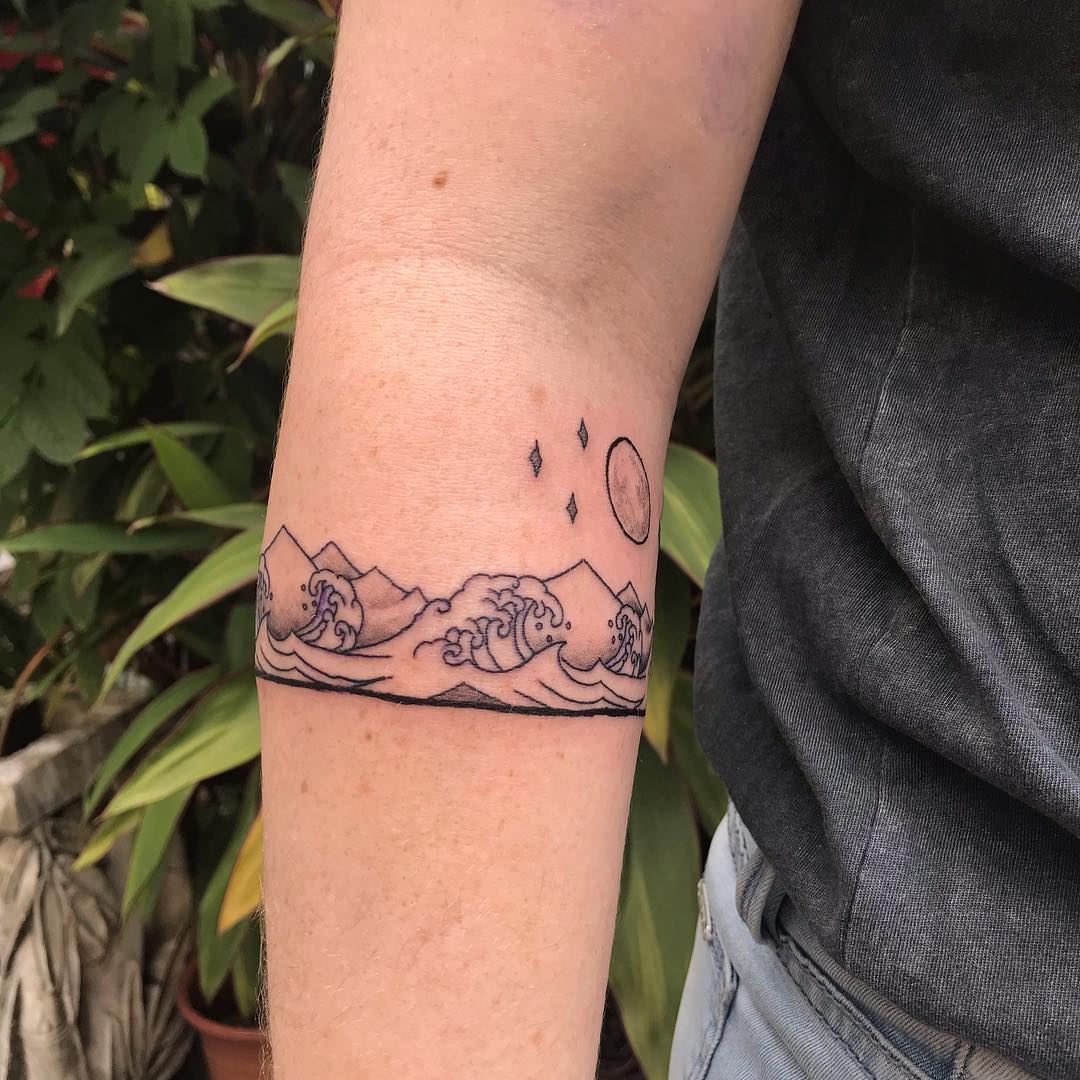 Gems Tattoo Studio  A wildlife lover came with a concert to have a arm  band tattoo which includes wolf mountains forest and sun   hope you  guys like it  